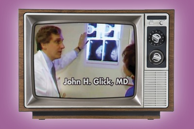 A still image from a Channel 10 TV segment in 1991 shows a young John Glick, MD, now an emeritus professor, reviewing mammogram scans with reporter Lu Ann Cahn, who was his patient.